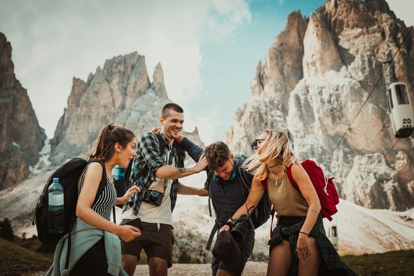 Friends laughing on a mountain hike